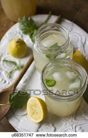 Studio shot of lemonade in jar and glass View Large Photo Image Stock Photo - Studio shot of lemonade in jar and glass. Fotosearch