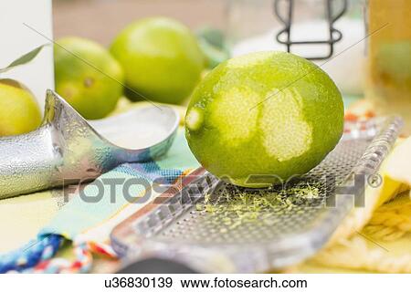 Studio shot of lime and grater View Large Photo Image Stock Photo - Studio shot of lime and grater. Fotosearch