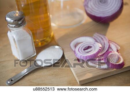 Stock Image - Studio shot of red onion and salt. Fotosearch