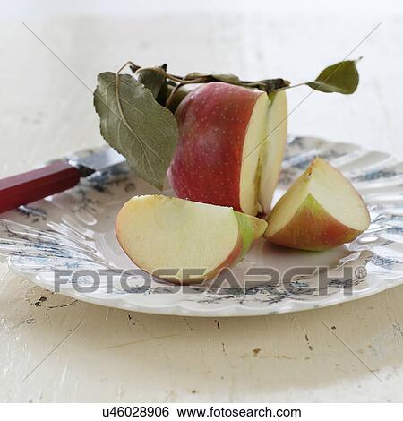 Studio shot of sliced apple on plate View Large Photo Image Stock Photograph - Studio shot of sliced apple on plate. Fotosearch