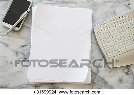Picture - Studio shot of smart phone, sheets of paper, pen and computer keyboard. Fotosearch