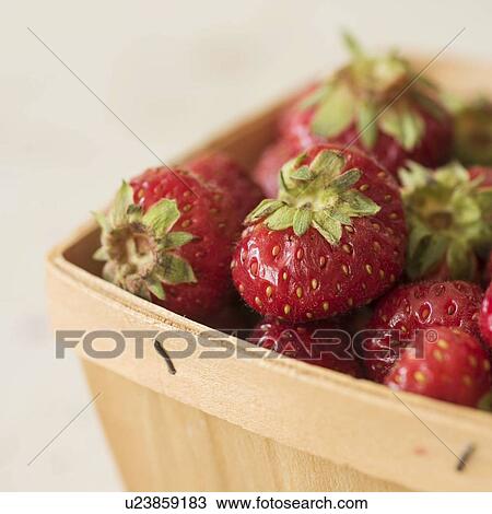 Stock Image - Studio shot of strawberries. Fotosearch