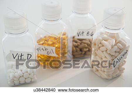 Stock Image - Studio shot of various pills in bottles. Fotosearch