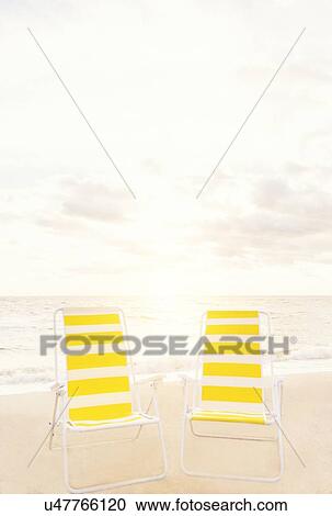 Two empty chairs on beach View Large Photo Image Stock Image - Two empty chairs on beach. Fotosearch