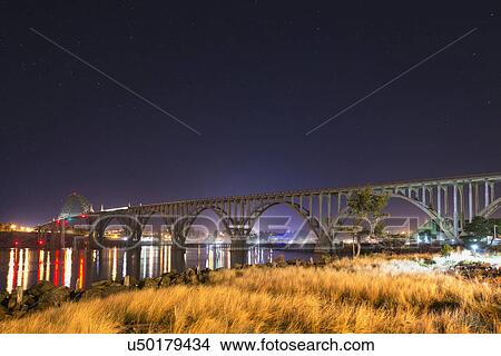 View of arch bridge at night View Large Photo Image Picture - View of arch bridge at night. Fotosearch