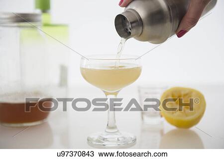 Woman pouring cocktail View Large Photo Image Stock Image - Woman pouring cocktail. Fotosearch