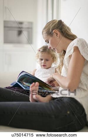 Woman teaching young girl (2-3) at home View Large Photo Image Stock Photography - Woman teaching young girl (2-3) at home. Fotosearch
