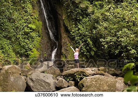 Woman under waterfall View Large Photo Image Stock Image - Woman under waterfall. Fotosearch