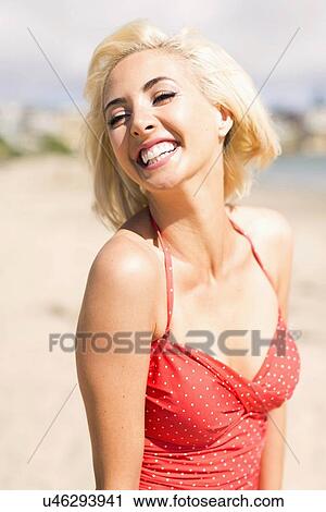 Woman wearing red one piece swimsuit posing on sandy beach View Large Photo Image Stock Image - Woman wearing red one piece swimsuit posing on sandy beach. Fotosearch