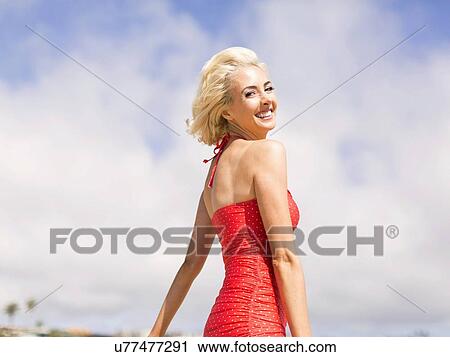 Woman wearing red one piece swimsuit posing to camera View Large Photo Image Stock Image - Woman wearing red one piece swimsuit posing to camera. Fotosearch
