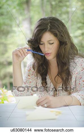 Picture - Young woman writing letter. Fotosearch