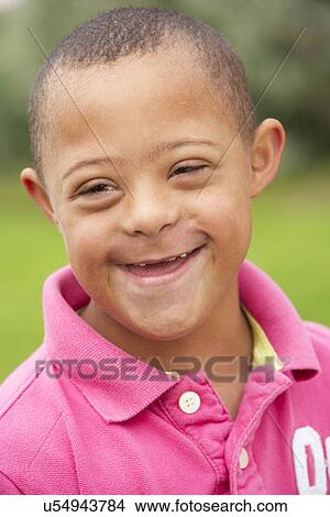 9 year old boy with Downs Syndrome View Large Photo Image Picture - 9 year old boy with Downs Syndrome. Fotosearch