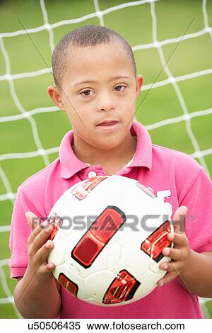 9 year old boy with Downs Syndrome View Large Photo Image Stock Photography - 9 year old boy with Downs Syndrome. Fotosearch