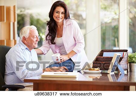Adult Daughter Helping Father With Laptop View Large Photo Image Stock Photo - Adult Daughter Helping Father With Laptop. Fotosearch