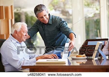 Adult Son Helping Father With Laptop View Large Photo Image Stock Image - Adult Son Helping Father With Laptop. Fotosearch