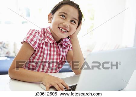 Asian Child Using Laptop At Home View Large Photo Image Stock Photography - Asian Child Using Laptop At Home. Fotosearch
