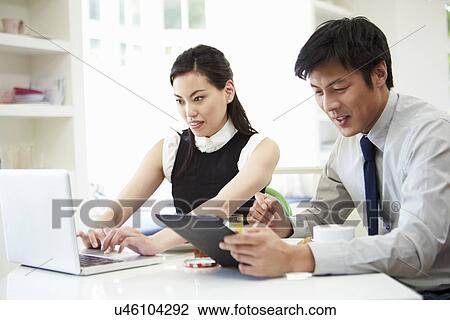 Asian Couple Using Digital Devices At Breakfast Table View Large Photo Image Stock Image - Asian Couple Using Digital Devices At Breakfast Table. Fotosearch