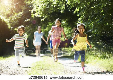 Asian Family Enjoying Walk In Countryside View Large Photo Image Stock Photography - Asian Family Enjoying Walk In Countryside. Fotosearch