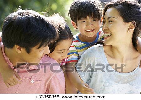 Asian Family Enjoying Walk In Summer Countryside View Large Photo Image Stock Photography - Asian Family Enjoying Walk In Summer Countryside. Fotosearch