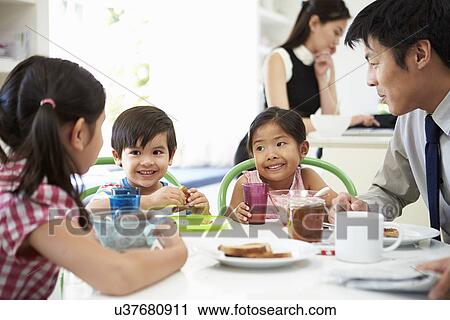 Asian Family Having Breakfast Before Husband Goes To Work View Large Photo Image Stock Image - Asian Family Having Breakfast Before Husband Goes To Work. Fotosearch