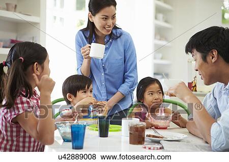 Asian Family Having Breakfast Together In Kitchen View Large Photo Image Stock Photo - Asian Family Having Breakfast Together In Kitchen. Fotosearch