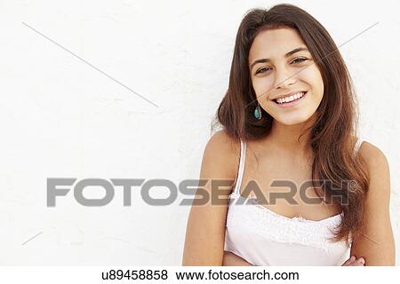 Attractive Hispanic Teenage Girl Leaning Against Wall View Large Photo Image Stock Photo - Attractive Hispanic Teenage Girl Leaning Against Wall. Fotosearch