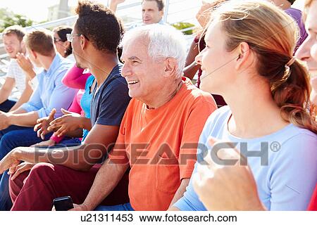 Stock Image - Audience Cheering At Outdoor Concert Performance. Fotosearch