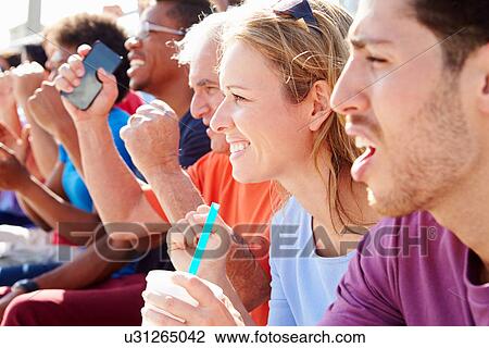 Stock Image - Audience Cheering At Outdoor Concert Performance. Fotosearch