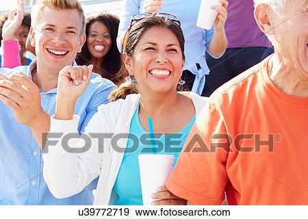 Stock Photo - Audience Cheering At Outdoor Concert Performance. Fotosearch