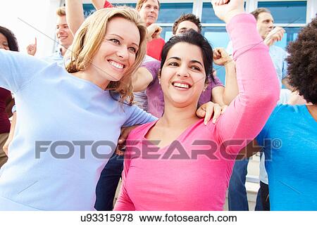 Stock Photo - Audience Dancing At Outdoor Concert Performance. Fotosearch
