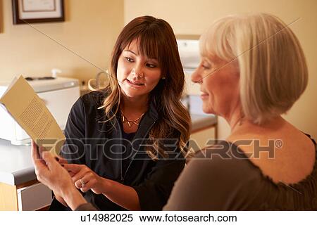 Beautician Advising Female Client On Beauty Products View Large Photo Image Stock Photography - Beautician Advising Female Client On Beauty Products. Fotosearch