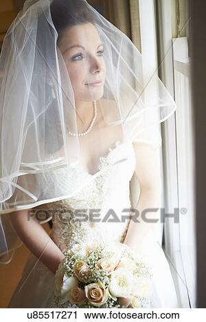 Beautiful Bride Wearing Wedding Dress Holding Bouquet View Large Photo Image Stock Image - Beautiful Bride Wearing Wedding Dress Holding Bouquet. Fotosearch