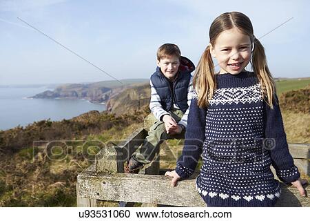 Boy And Girl Walking Along Coastal Path View Large Photo Image Stock Image - Boy And Girl Walking Along Coastal Path. Fotosearch