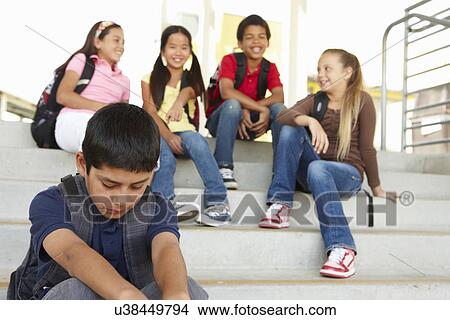 Boy being bullied in school View Large Photo Image Picture - Boy being bullied in school. Fotosearch