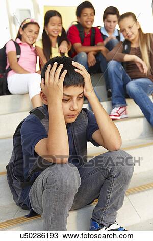 Boy being bullied in school View Large Photo Image Stock Image - Boy being bullied in school. Fotosearch