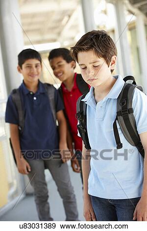 Boy being bullied in school View Large Photo Image Stock Photo - Boy being bullied in school. Fotosearch