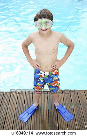Boy by outdoor swimming pool View Large Photo Image Picture - Boy by outdoor swimming pool. Fotosearch