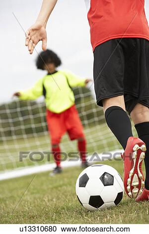Boy goalkeeper braced for penalty shot View Large Photo Image Stock Image - Boy goalkeeper braced for penalty shot. Fotosearch