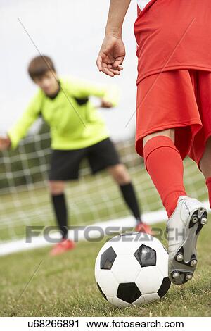 Boy goalkeeper braced for penalty shot View Large Photo Image Stock Image - Boy goalkeeper braced for penalty shot. Fotosearch