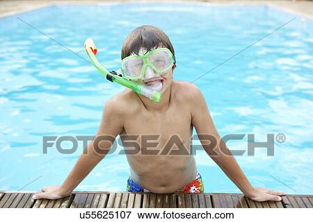 Boy in outdoor swimming pool View Large Photo Image Stock Photo - Boy in outdoor swimming pool. Fotosearch