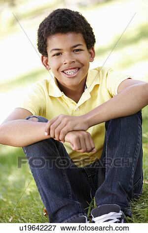 Boy in park portrait View Large Photo Image Stock Photo - Boy in park portrait. Fotosearch