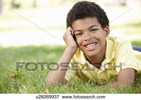 Stock Photo - Boy in park portrait. Fotosearch
