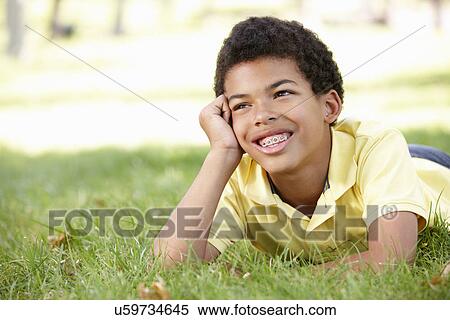 Boy in park portrait View Large Photo Image Stock Photography - Boy in park portrait. Fotosearch