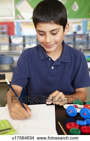 Boy in physics class View Large Photo Image Picture - Boy in physics class. Fotosearch