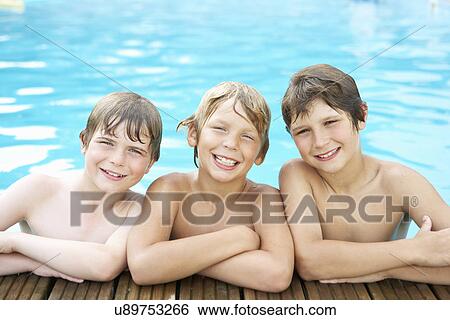 Boys in outdoor swimming pool View Large Photo Image Stock Photograph - Boys in outdoor swimming pool. Fotosearch