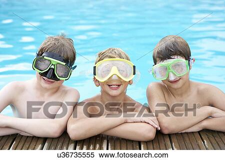 Boys in outdoor swimming pool View Large Photo Image Stock Photography - Boys in outdoor swimming pool. Fotosearch