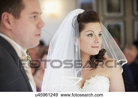 Bride And Groom During Wedding Ceremony View Large Photo Image Stock Photo - Bride And Groom During Wedding Ceremony. Fotosearch