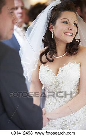 Bride And Groom During Wedding Ceremony View Large Photo Image Stock Photo - Bride And Groom During Wedding Ceremony. Fotosearch