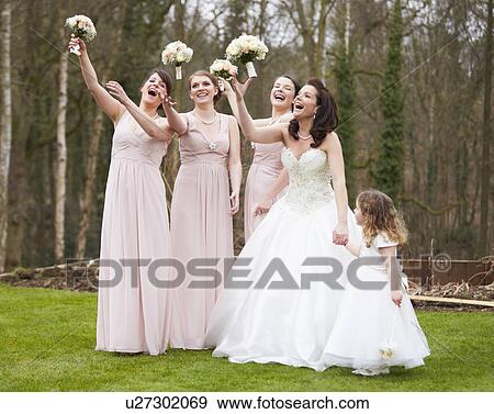 Stock Photo - Bride With Bridesmaids On Wedding Day. Fotosearch