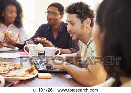 Business People Having Meeting And Eating Pizza View Large Photo Image Stock Image - Business People Having Meeting And Eating Pizza . Fotosearch